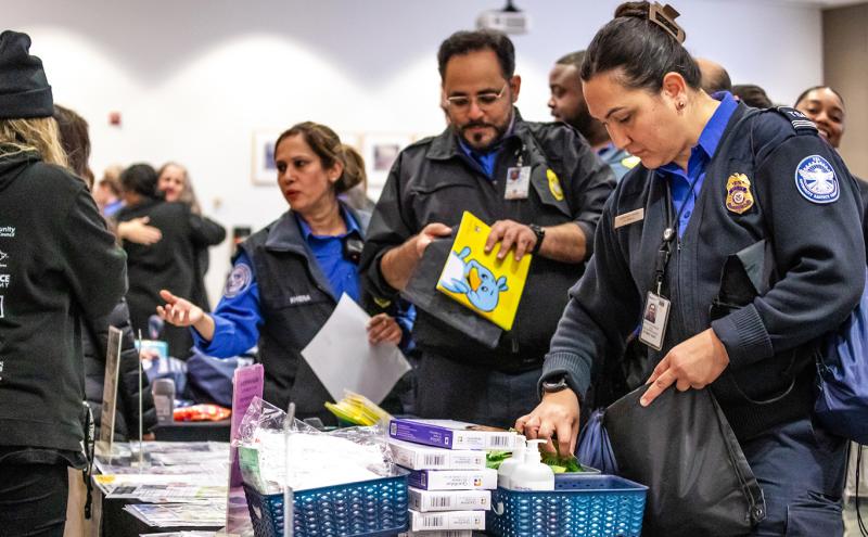 Federal workers visit a resource fair at SEA Airport.