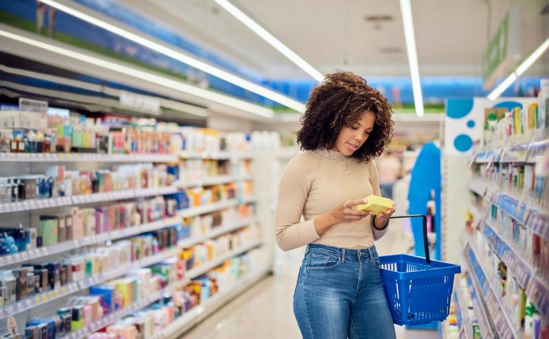 woman shopping in the healthcare aisle of a store