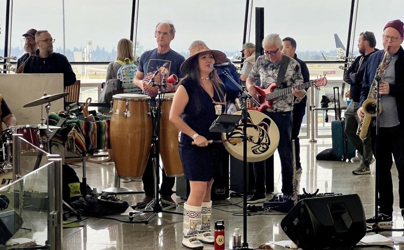 Band playing in Central terminal with local Indigenous instruments