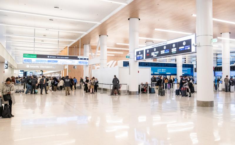 Travelers moving through the newly remodeled north end of SEA Airport's main terminal