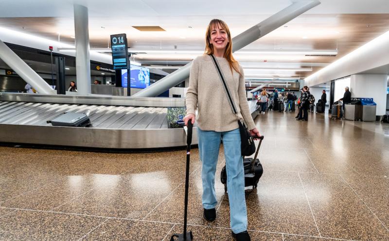 Traveler with a can walking through baggage claim