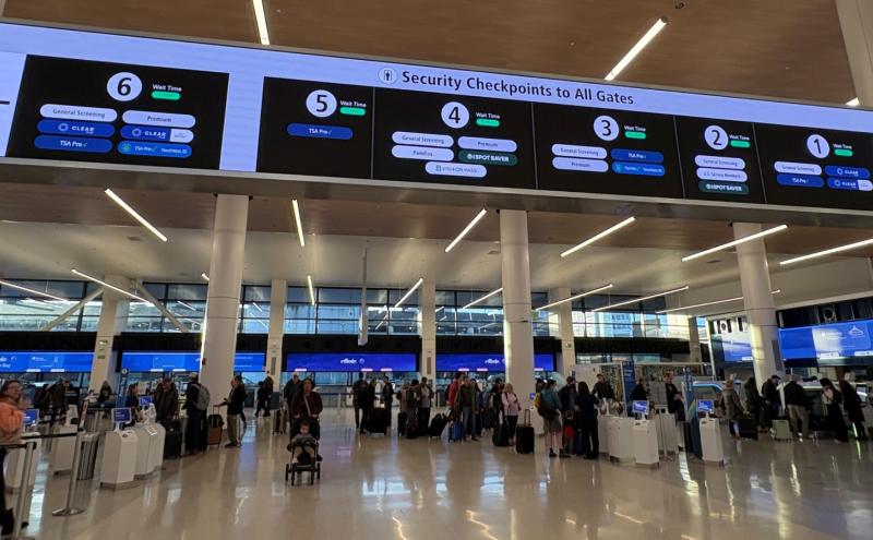 The new signage over gates at SEA airport with wait times displayed