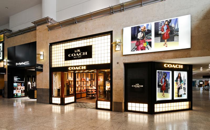 Current Coach and M.A.C storefronts in the Central Terminal at SEA Airport