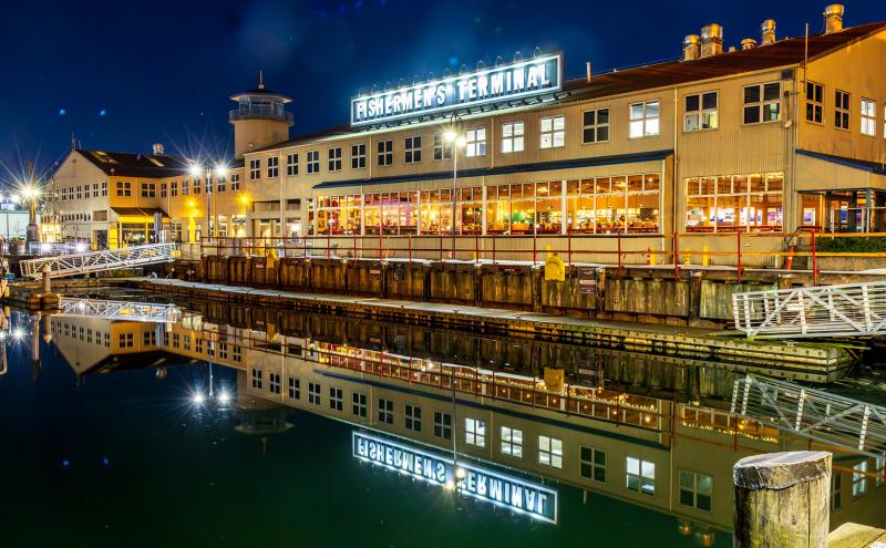 Fishermen's Terminal Fishermen's Center Building from the water at night