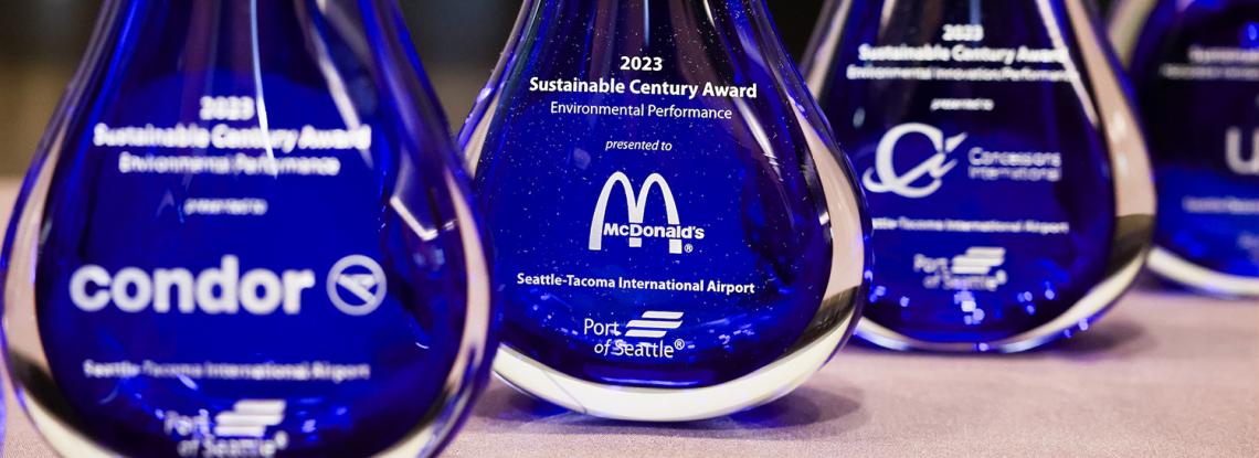Four engraved awards presented at the 2024 Sustainable Century Awards luncheon
