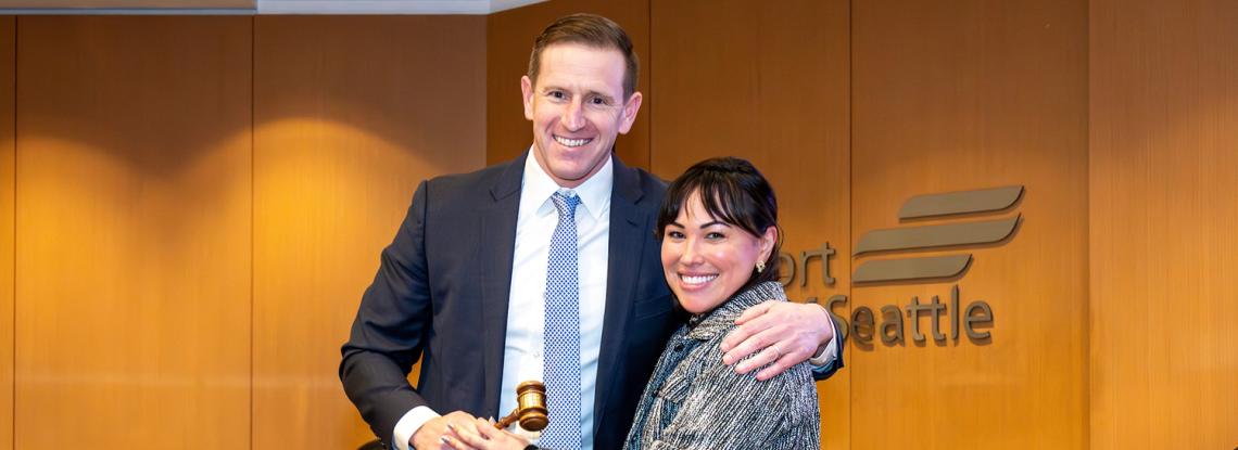 Former Commission President Toshiko Hasegawa passes the gavel to Ryan Calkins, Commission President for 2026.