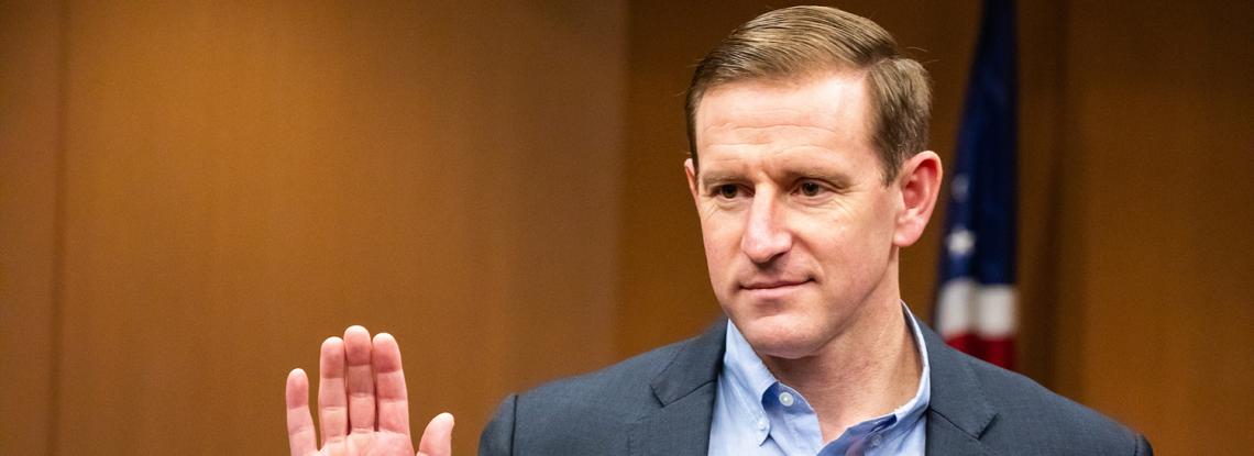 Commissioner Calkins takes the oath of office.