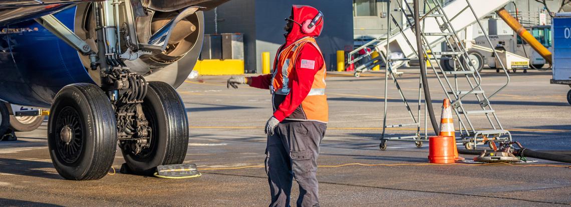 SEA worker near an aircraft.