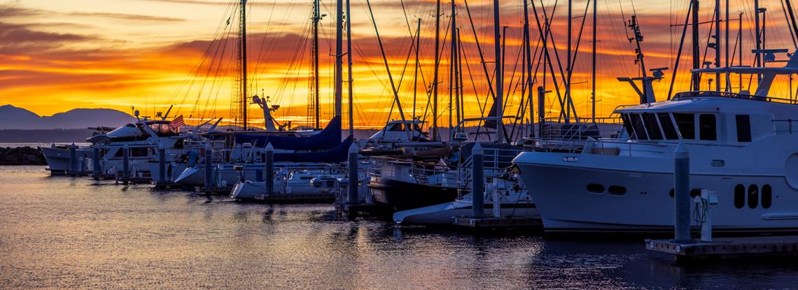 Boats moored at twilight at Shilshole Bay Marina.