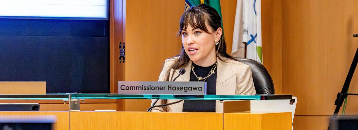 Cmr. Hasegawa speaks at a Port Commission meeting.