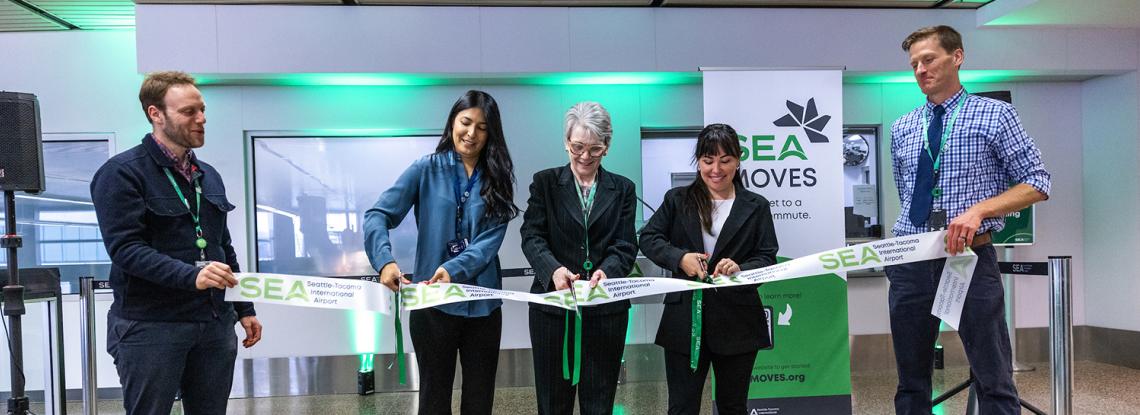Commissioner Hasegawa joins Cassie Uribe of Alaska Airlines and SEA Managing Director Wendy Reiter for a ceremonial ribbon cutting