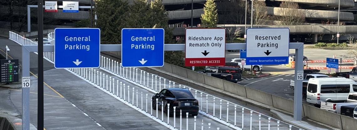 A car driving up to the SEA Airport Parking Garage. 
