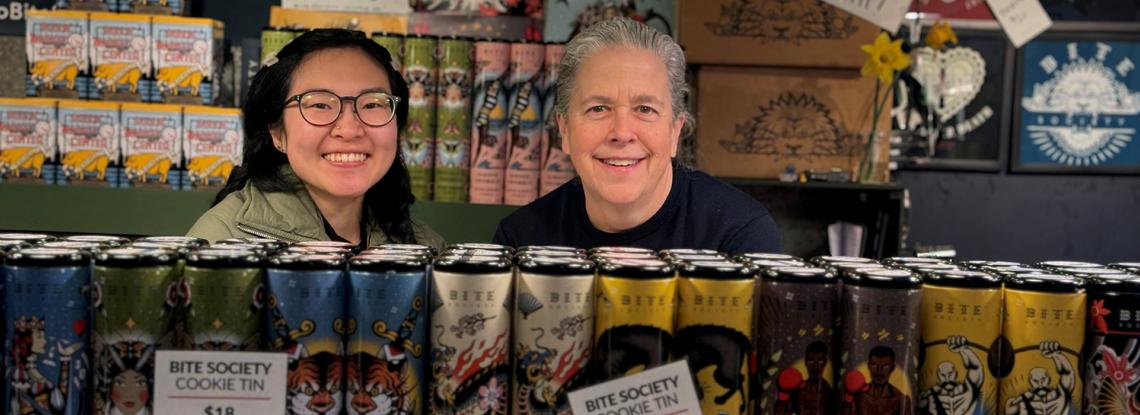 Bite Society staff help customers at their Pike Place Market kiosk