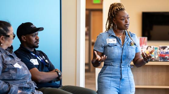 LaCretiah Clayor (right) speaks to Rainier Beach High School students, while Port employees participate in a career panel.