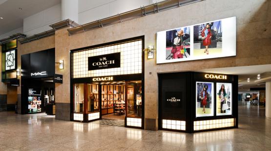 Current Coach and M.A.C storefronts in the Central Terminal at SEA Airport