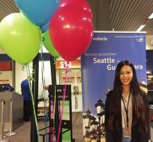 Photo of Yi Chen at a customer service checkpoint