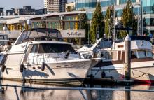Two recreational vessels moored at Bell Harbor Marina