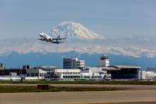 Alaska Airlines takes off with a stunning Mt. Rainier in the distance