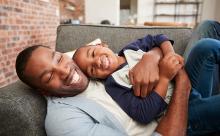Father and son together at home. 