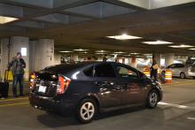 An App-Based Rideshare Car Picks Up Paassengers at Sea-Tac Airport