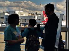 Autistic children practice at the airport