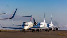 Planes await on the taxiway for takeoff at Sea-Tac Airport