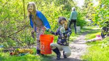 Kids help clean up a local park