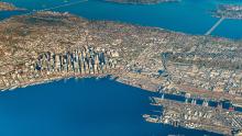 Aerial view of Seattle, Elliott Bay, and East Waterway with Lake Washington in the background