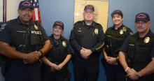 Port of Seattle Police Officers wearing breast cancer badges and hats