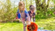 Two girls participate in a community clean-up volunteer day, South Seattle Duwamish area, April 2018