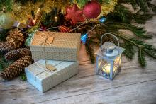 Tree and wrapped gifts with a lantern