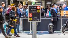 Passengers at Sea-Tac Airport make their way to security screening checkpoints