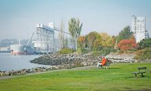 People sitting on a bench at Centennial Park