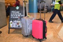 Suitcases in front of a Starbucks store