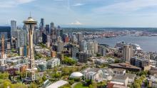 Norwegian Joy with the Seattle skyline behind 
