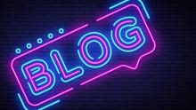 Blog neon sign on a brick background