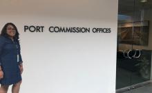 Caitlin Sio in front of Commission Office