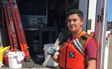 Victor Montoya by the work truck