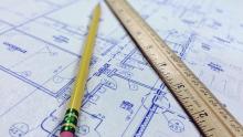 Pencil and ruler laying on a blueprint