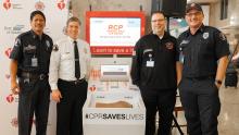 From L to R: Port of Seattle Fire Department Captain Baruso; Chief Randy Krause; Battalion Chief Schnase; and Captain Hendrickx at SEA's CPR kiosk, November 13, 2019.