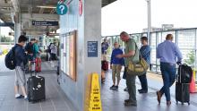 Link light rail passengers at the SEA Airport station, May 2019.