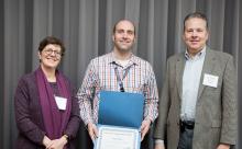 Perry Welch is recognized by Maritime Managing Director Stephanie Jones Stebbins and Chief Financial Officer Dan Thomas. 