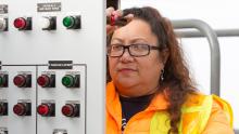Shannon Neal works on an electrical panel on a Port of Seattle property, Feb. 2015