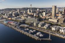 Aerial image of Bell Harbor Marina with Seattle skyline in the background
