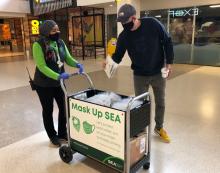 Mask Up cart distributes care kits to SEA airport passengers 