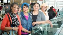 Women of color at SEA Airport 