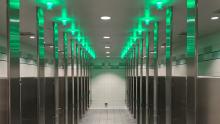 Green "Tooshlights" line the ceiling of a restroom at SEA Airport, Aug. 28, 2020