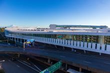 International Arrival Facility completed exterior of Arrivals Hall with elevated pedestrian walkway in background