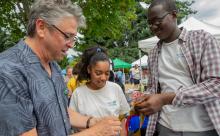 Commissioner Felleman holds kelp and educates students