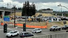 Cell Phone lot with dump trucks and workers beginning to make needed improvements July 2021